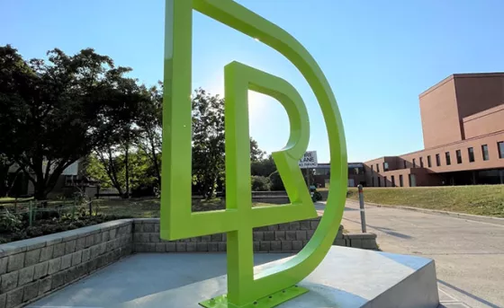 RDP monogram in front of school