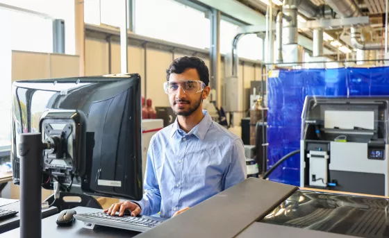 Student working in CIM-TAC using equipment