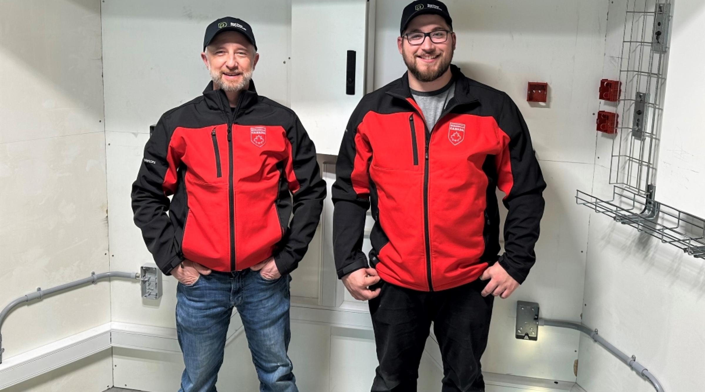 Electrical Apprentice Tristen Hatto and Electrician Instructor Terry Welch posing for photo