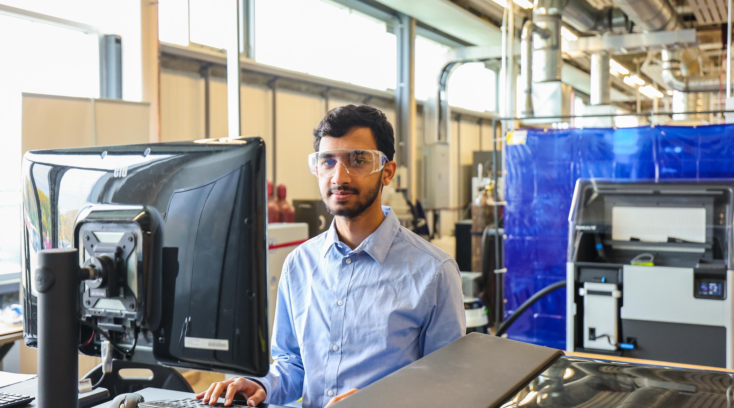 Student working in CIM-TAC using equipment