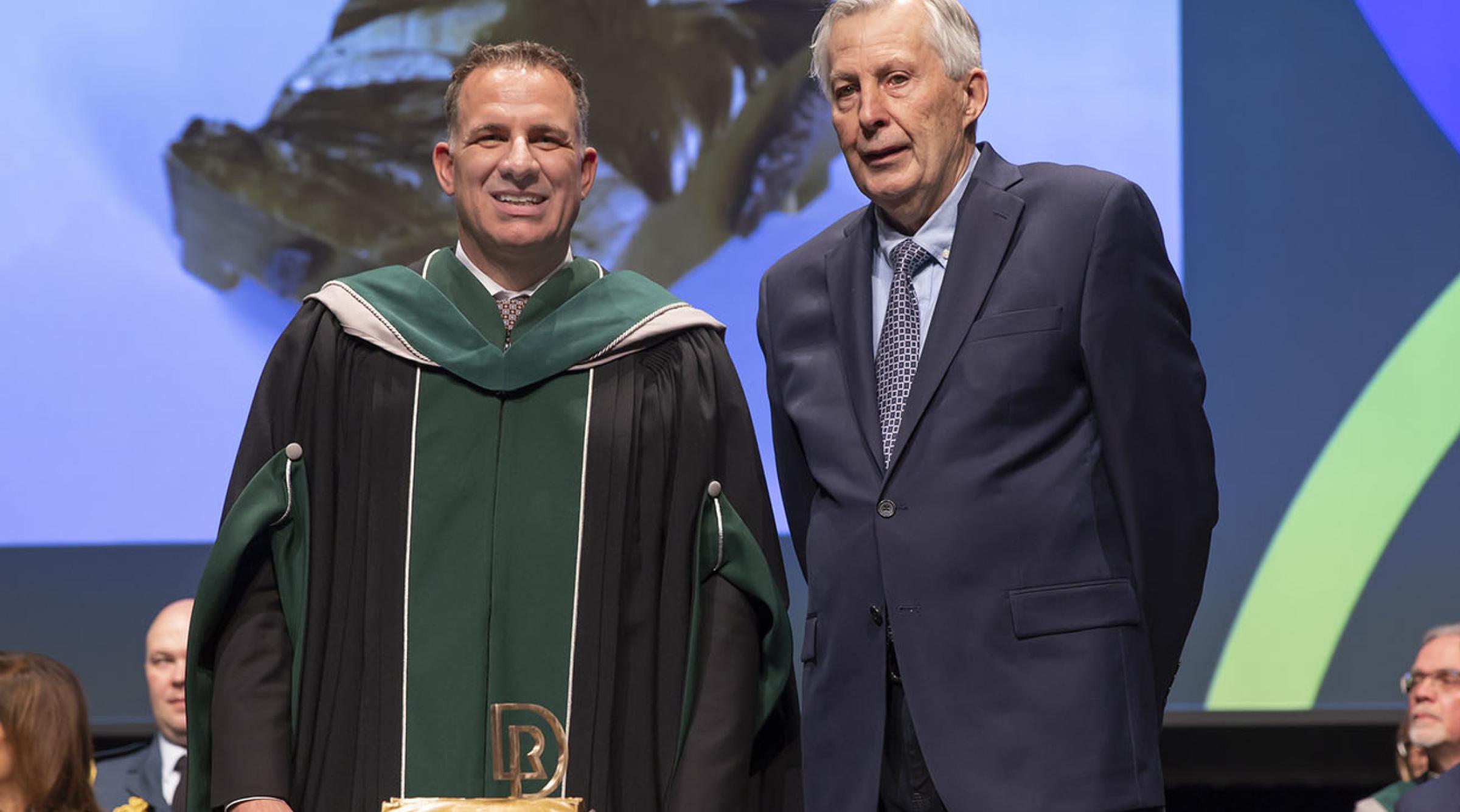 Stuart Cullum, President, joined on stage at the President Installation Ceremony by Ian Cook, Visual Art Instructor