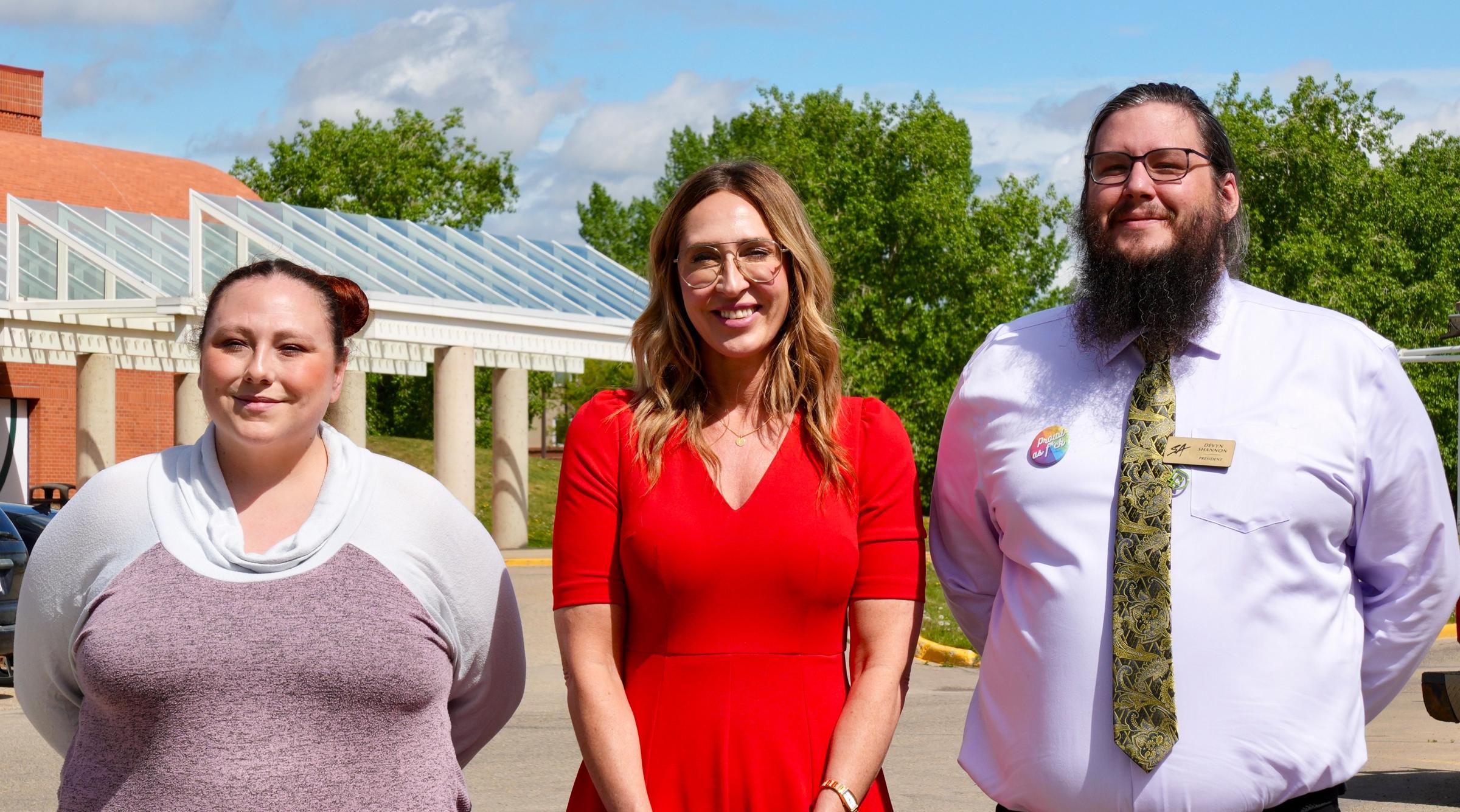 Bobbi-Jo L'Hirondelle, Lindsay Engel and Devyn Shannon Smile at Pride Flag Raising event