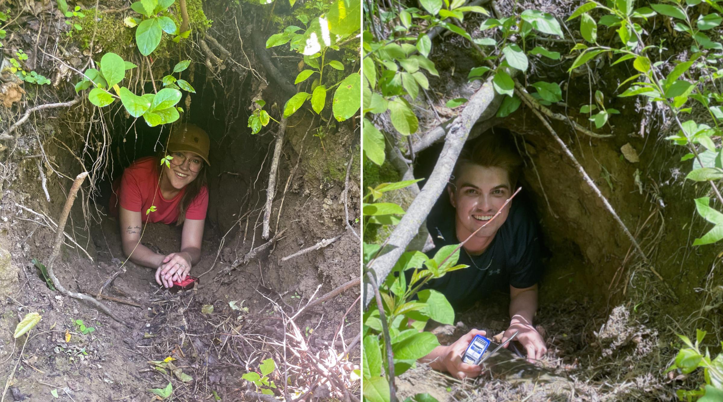 Researchers Meggy & Kyle smile while laying in the entrance of a bear's den.