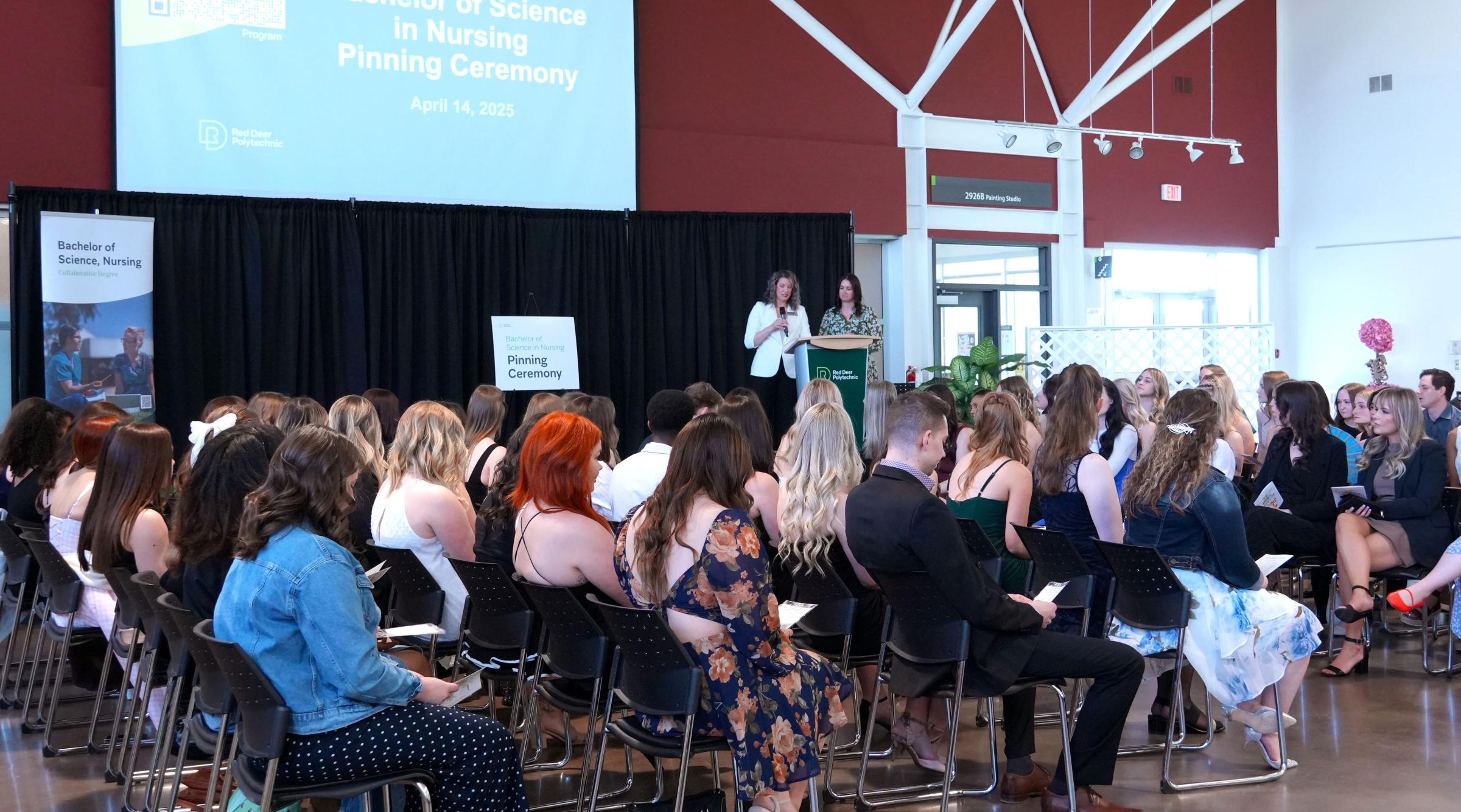 RDP Nursing faculty address a group of graduating nurses and their supporters