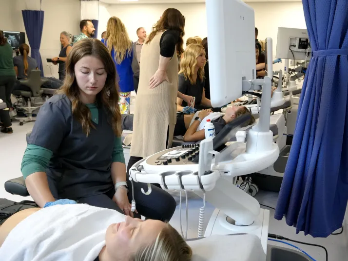 Students and teachers demoing the new sonography equipment in the new lab