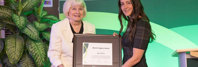 Wife of Gary W. Harris accepting award
