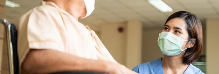 Nurse helping out patient