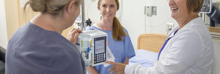 Nursing student collaborating with instructor