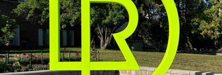 RDP Logo monogram in front of college