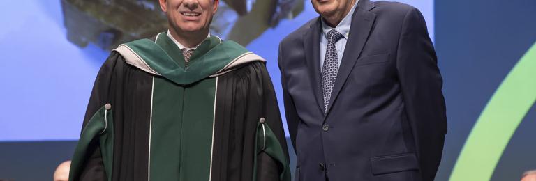 Stuart Cullum, President, joined on stage at the President Installation Ceremony by Ian Cook, Visual Art Instructor