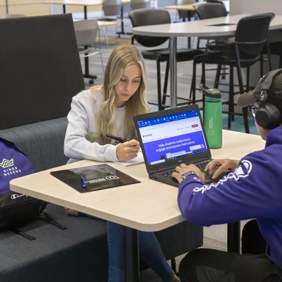 two RDP students studying in Library