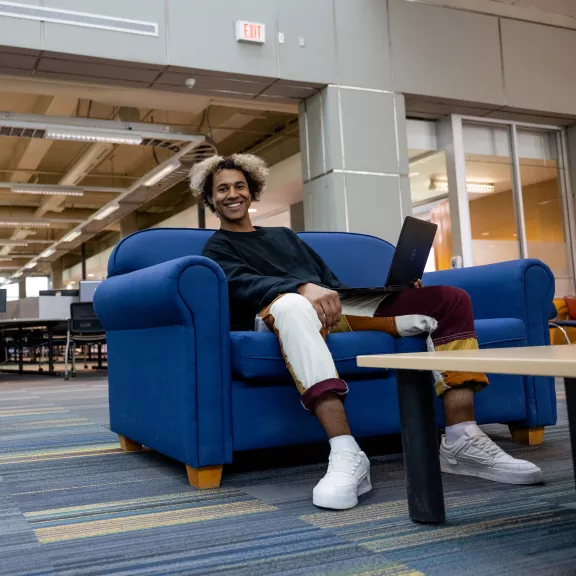student sitting in library