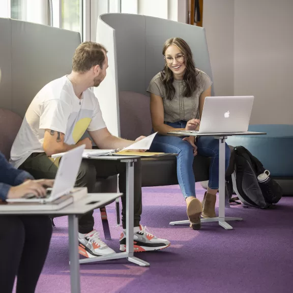 three students studying 