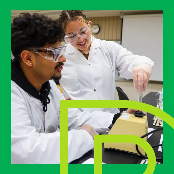 Two students in lab coats with RDP graphics overtop